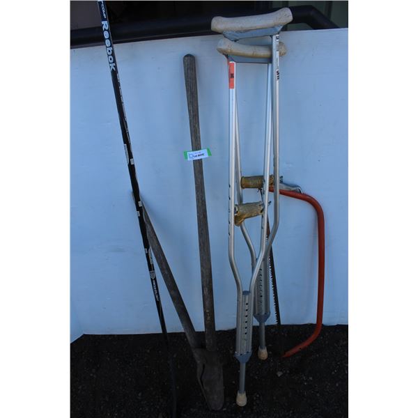 ** (2) Crutches & Reebok Hockey Stick & Post Hole Auger & Bow Saw
