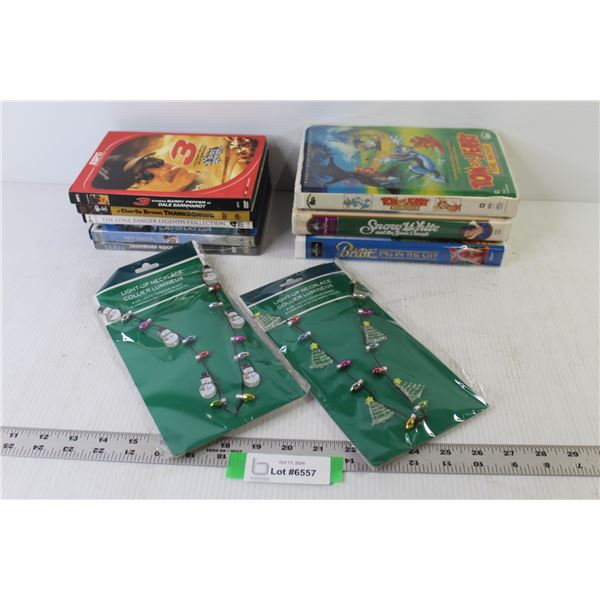 (3) VHS Tapes- Tom & Jerry - Snow White - (6) DVDs - Elvis - Terminator - Charlie Brown - (2) Light-