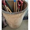 Image 1 : Large container with many shovel/broom handles - both used and new; plastic and wood