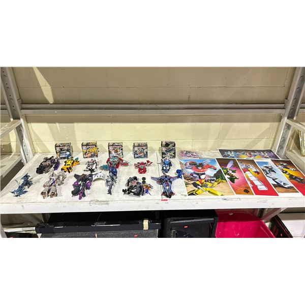 SHELF OF ASSORTED TRANSFORMERS TOYS & POSTERS