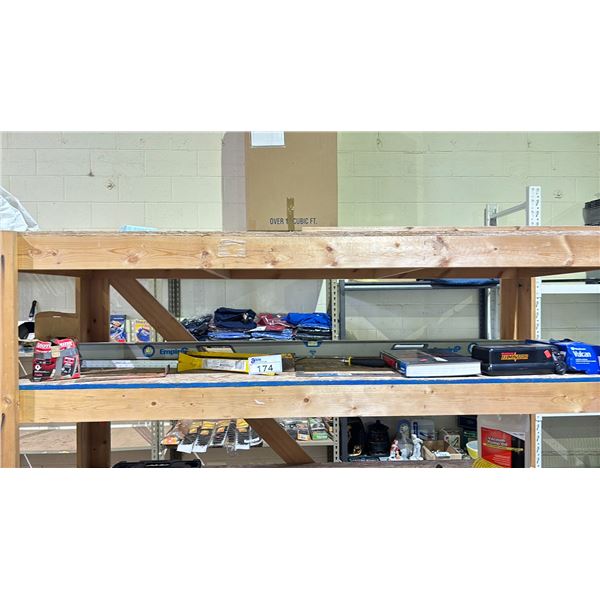 SHELF OF ASSORTED ITEMS INCLUDING; LEVEL, PRY BARS, BATTERY CHARGER & MORE