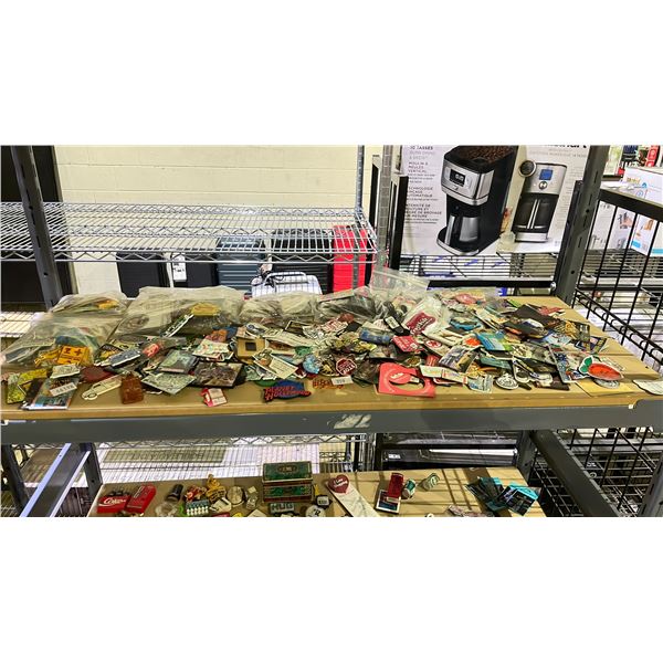 SHELF LOT OF ASSORTED MAGNETS AND STICKERS