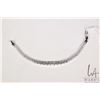 Image 1 : Platinum plated graduated tennis bracelet, set with colourless stone, adjustable 7"-8" in length