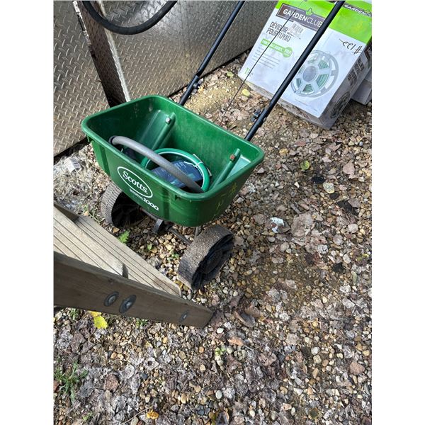 Step ladder ( 6ft)  spreader. 2- hose reels, tire tube.