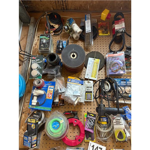 Large amt of various misc. hanging on the peg board.