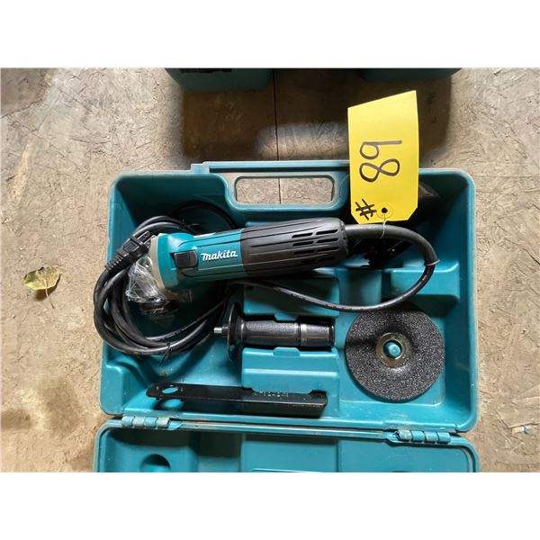 As new Makita electric angle grinder