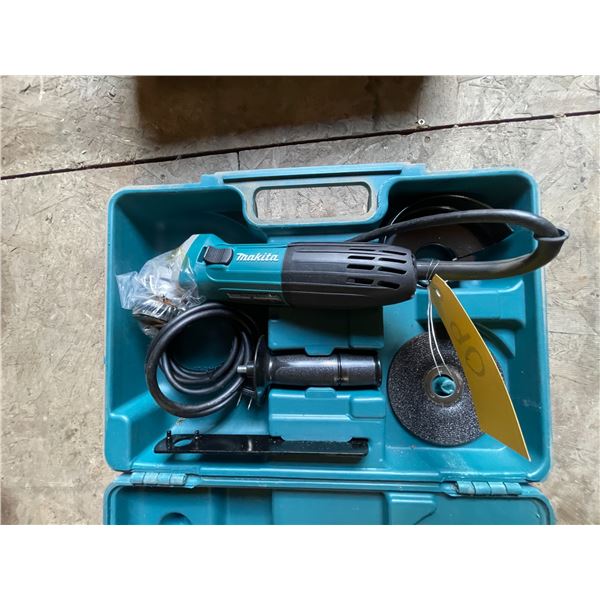 As new Makita electric angle grinder