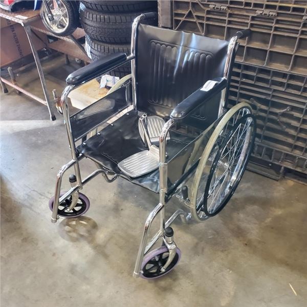 FOLDING WHEELCHAIR WITH FOOT HOLDS