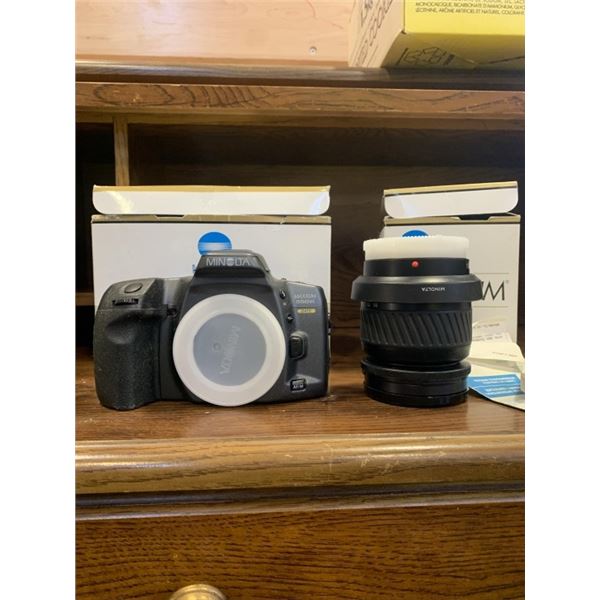 AS NEW MINOLTA CAMERA 500SL AND LENS ORIGINALLY $700