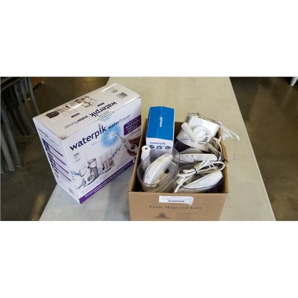 LOT OF WATERPIK WATER FLOSSERS ALL WORKING CLEAN AND SANITIZED