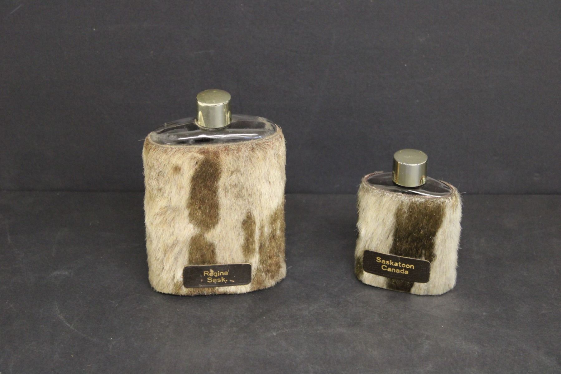 (2) Cow Hide Liquor Flasks, Regina and Saskatoon Bodnarus Auctioneering