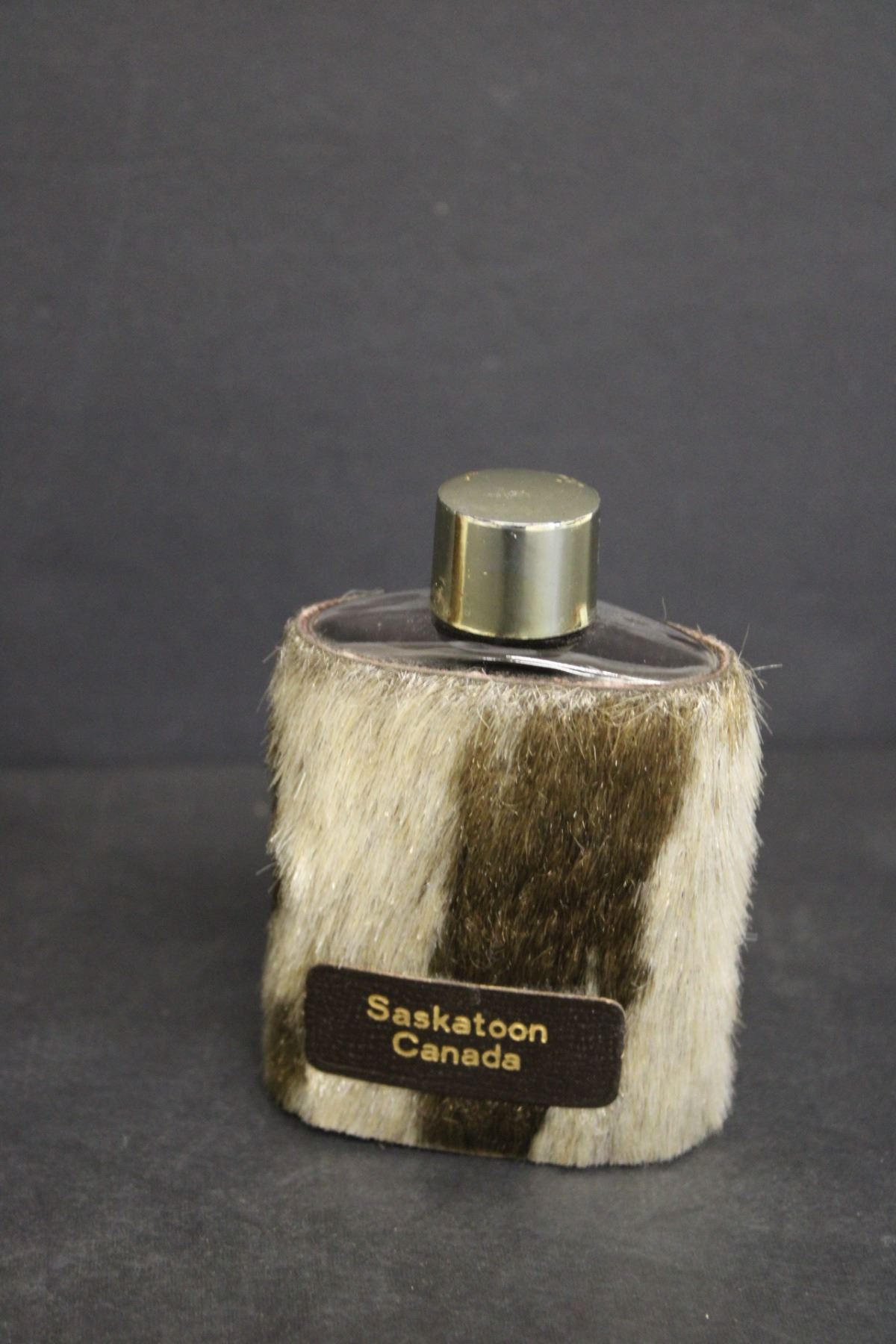 (2) Cow Hide Liquor Flasks, Regina and Saskatoon Bodnarus Auctioneering