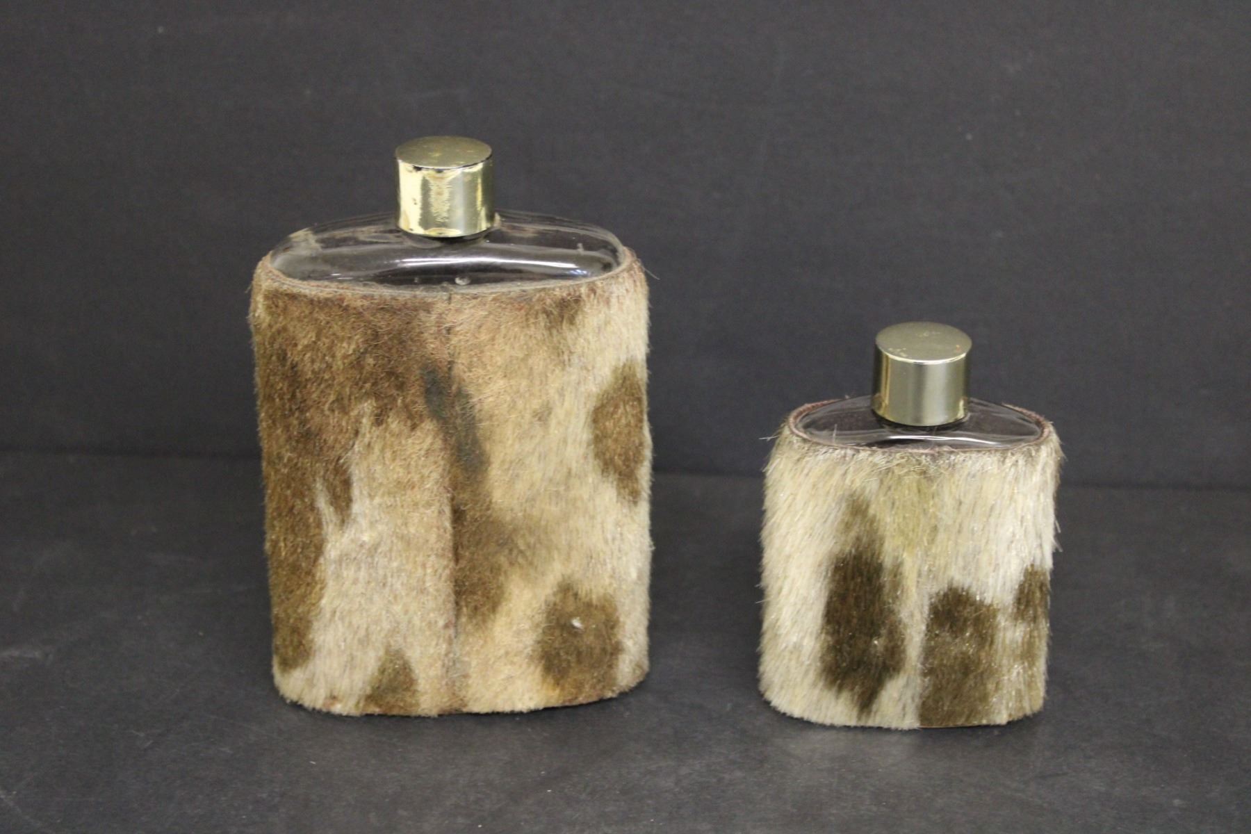 (2) Cow Hide Liquor Flasks, Regina and Saskatoon Bodnarus Auctioneering