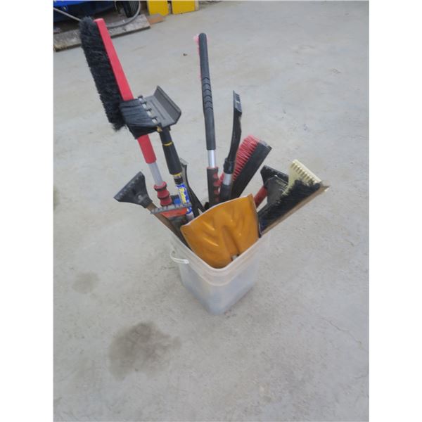 bucket of snow brushes