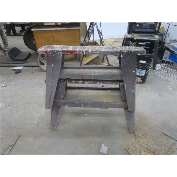 two wooden saw horses