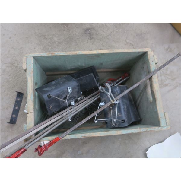 box of mole traps and steel rods