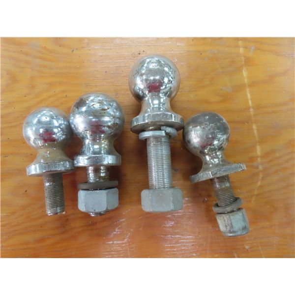 two 2" balls and two 2 5/16 " balls