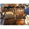 two decrotive rocking chairs