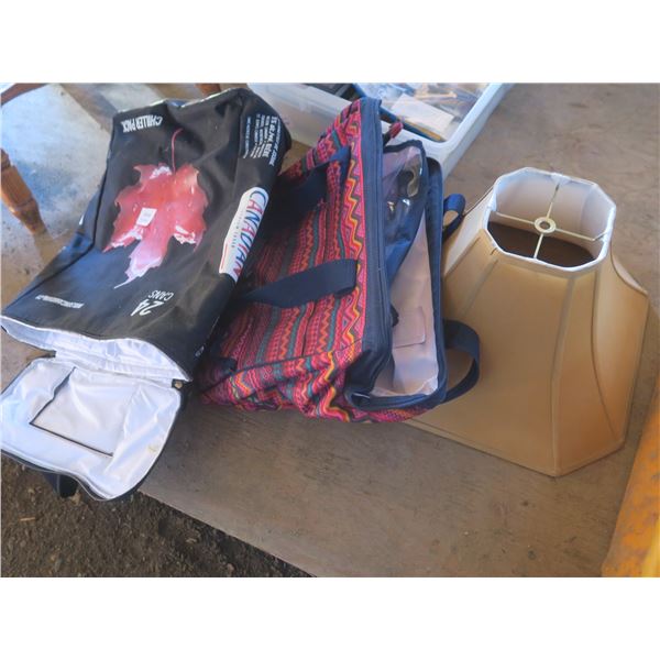 two cooler bags and a lamp shade