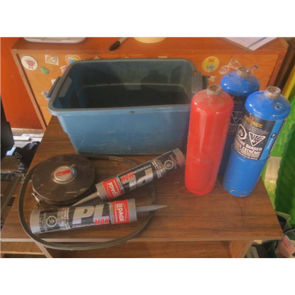 3 propane bottles and two bottles of caulking