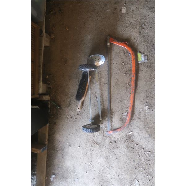 saw, ice fishing scoop and wheels
