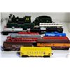 39)  LOT OF 14 VARIOUS VINTAGE MAISTO TRAIN CARS.