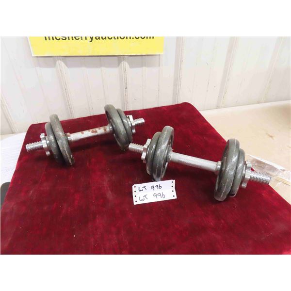 2 Dumbells with (4)  5lbs Weights (4) 2 1/2lbs Weights