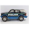 Image 4 : (3) Toy Trucks, 1996 Chevy Tahoe Police Vehicle, Tonka Dump Truck, Misc.