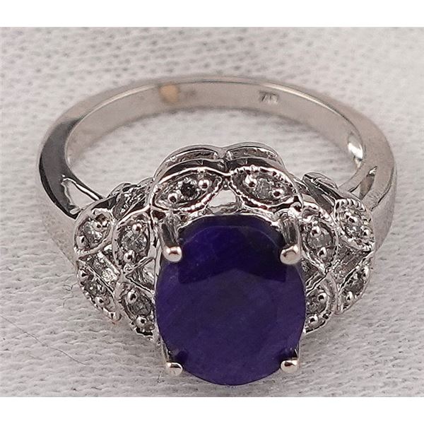 Sapphire and Diamond Women's Ring. It is made of 18k Gold and the ring size is 6.5.