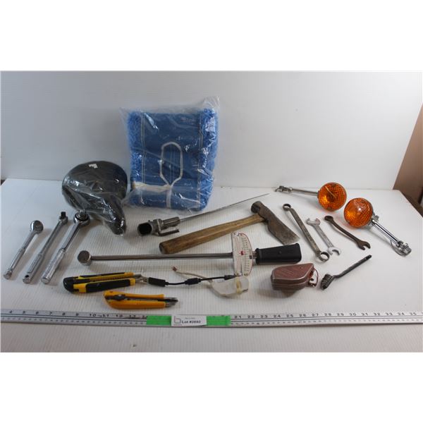 Bike Saddle, Ratchet Wrenches, Hatchet, Handsaw, Box Cutters, Motorcycle Turn Signals, Chalk Line an