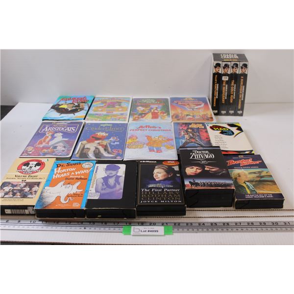 (16) VHS: Charlie Chaplin, Alice Cooper, Gilligan's Island, Mickey Mouse, Dr, Suess, Madonna, Misc.