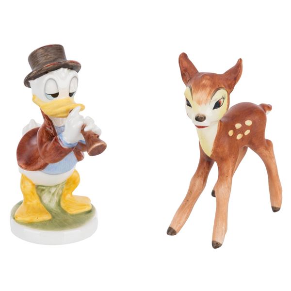A Pair of Goebel Donald Duck and Bambi Figurines.