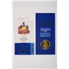 Image 2 : A Snow White 50th Anniversary Passport and Coin.