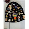Image 1 : Assorted pins on toque
