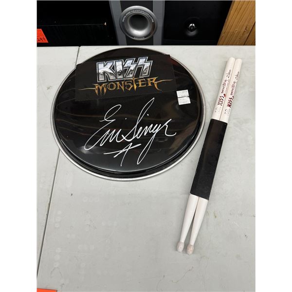 Kiss drum skin and sticks signed by Eric singer