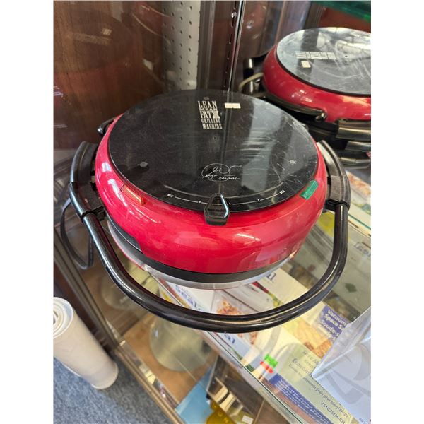 Lean mean fat grilling machine