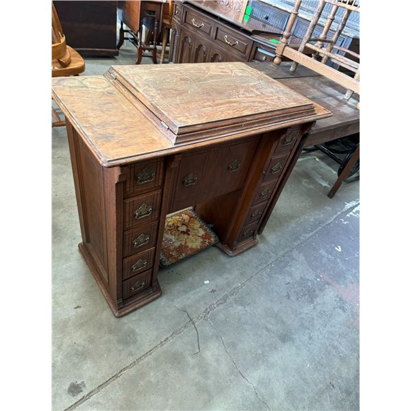 Singer sewing machine in cabinet