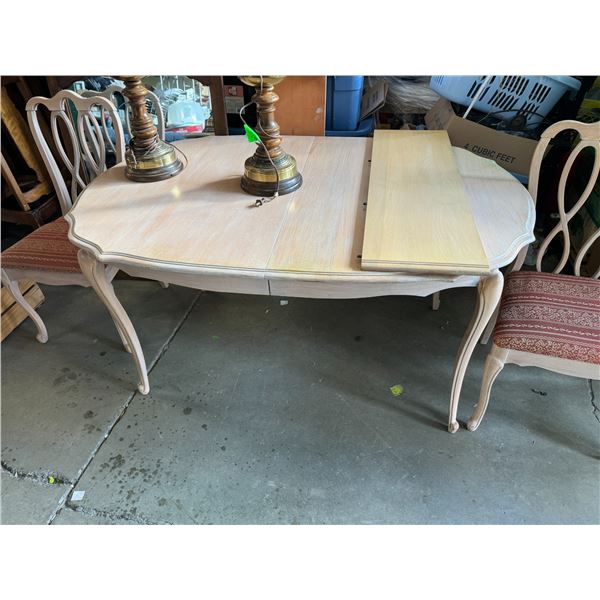 Table and three chairs with 2 leaves