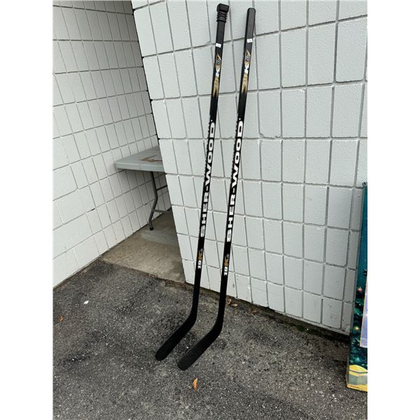 2 sherwood, right handed hockey sticks