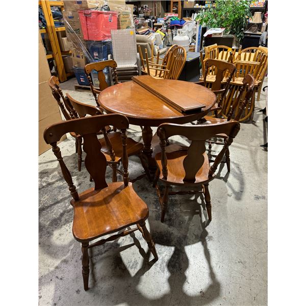 Krug maple table and chairs, two captains chairs, five other chairs 2 leaves