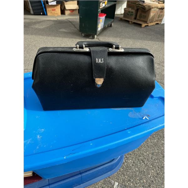 Antique doctors bag and medical book