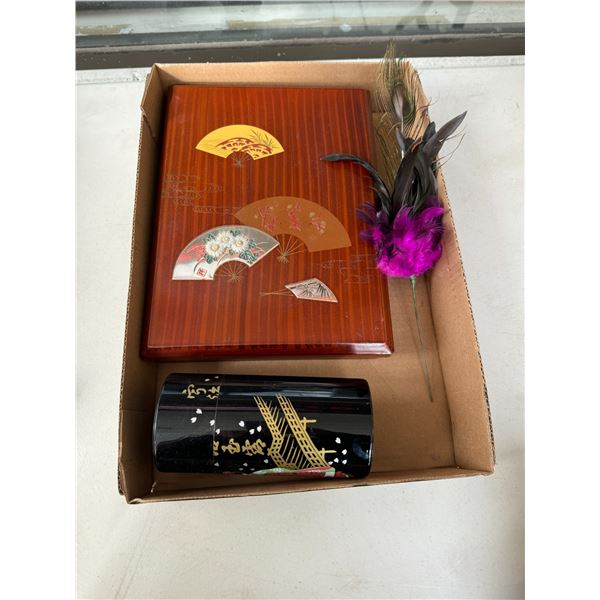 Decor, containers, and peacock feather