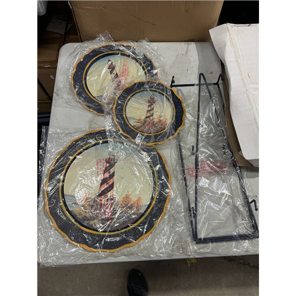 three lighthouse plates with stand