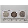 Image 1 : Three Canadian Voyageur silver dollar coins including 1935, 1936, and 1937
