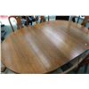 Image 2 : Quarter cut oak Canadiana dining room table with center pedestal, carved paw feet and three 8" inser