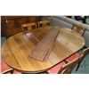 Image 2 : Round Mission style, split pedestal oak dining table 45" in diameter. Includes five 9" insert leaved