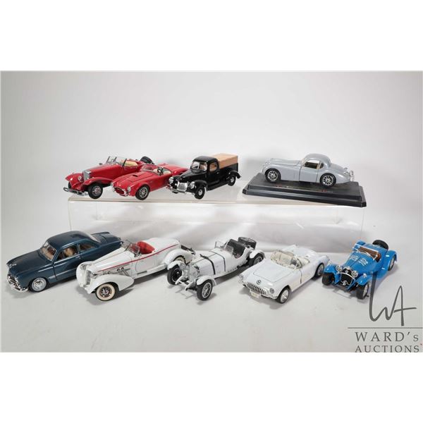 Nine die-cast cars including 1931 Mercedes-Benz SSKL by Danbury Mint, 1948 Jaguar, Ford Cobra, Frank