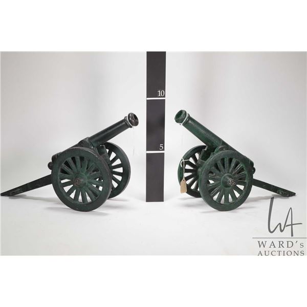 Two cast steel collectible cannons, each 16" in length with 6" wheels