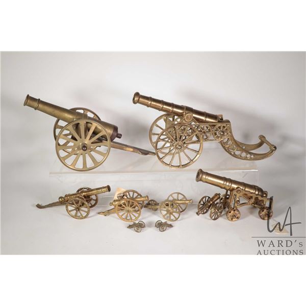 Selection of nine vintage brass collectible cannons, ranging from 1" - 16"