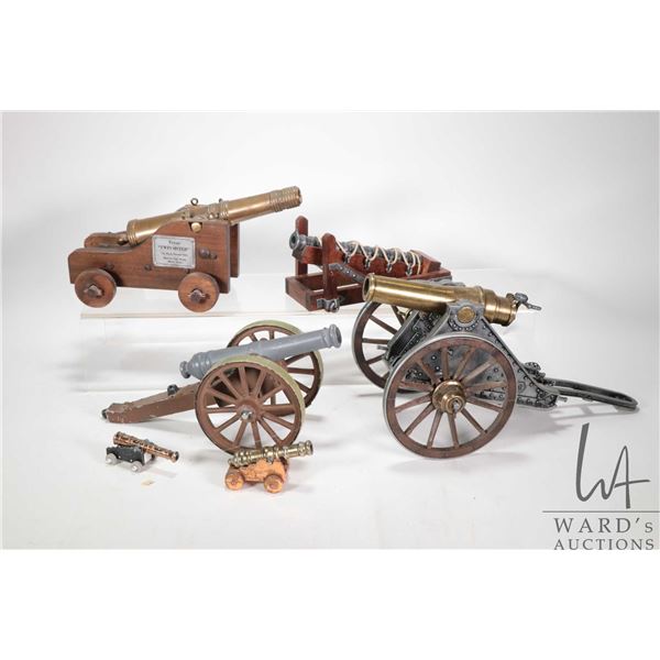 Six collectible cannons including, various styles and material including wood, brass, steel, aluminu